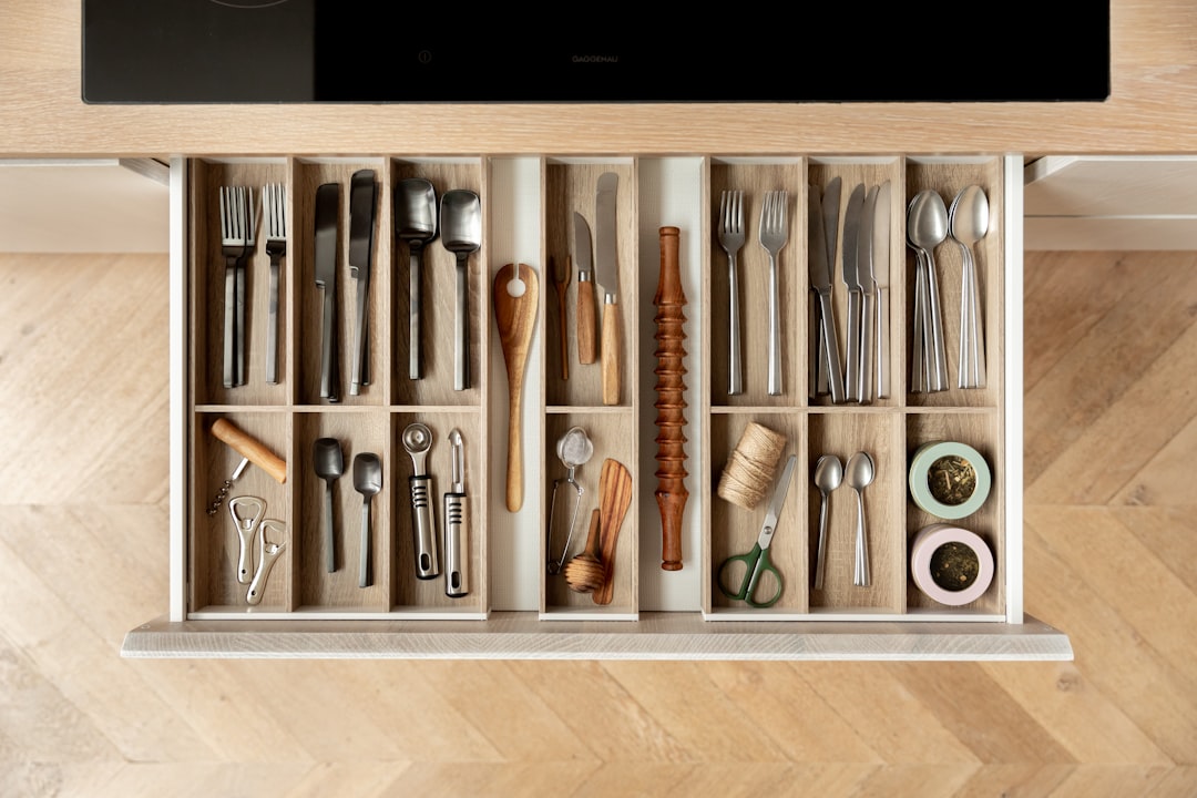 An organized kitchen drawer filled with neatly arranged utensils