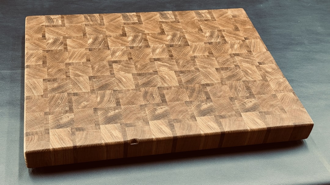 A thick end-grain wood cutting board with a checkerboard pattern